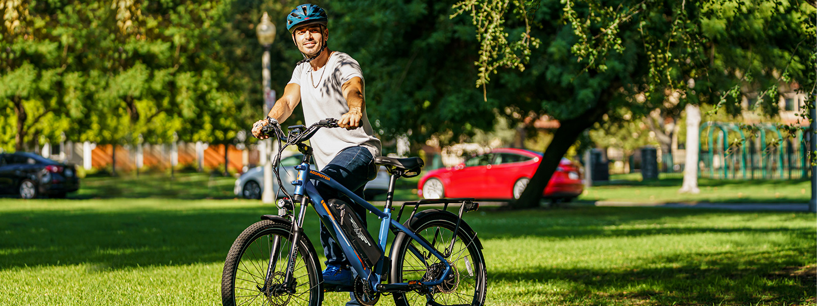 a young man with his blue Citypro ebike 