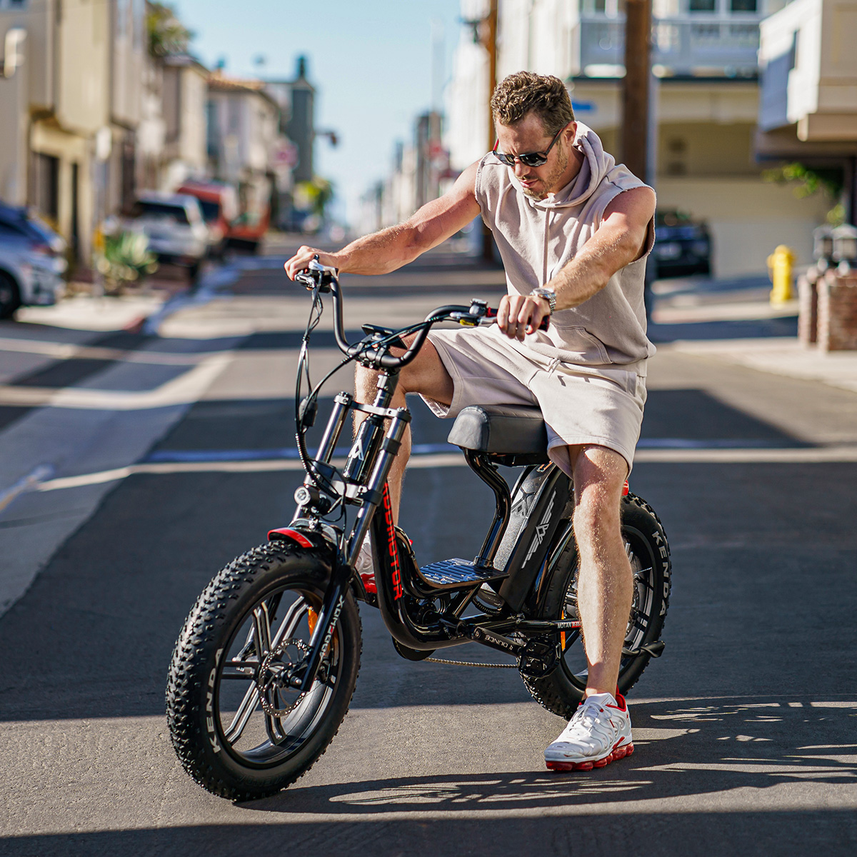  a man stops and looks at the m-66 r7 ebike cruiser 