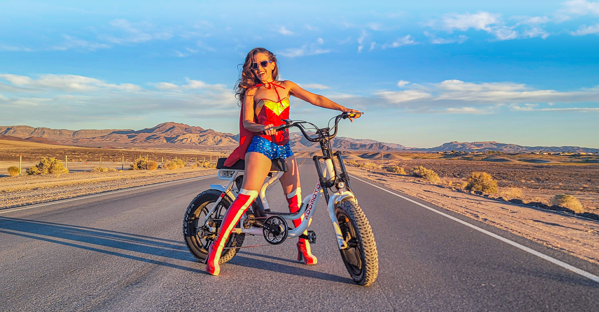 a woman cruises her m-66r7 Moped Cruiser Electric Bike 