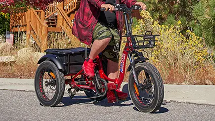 a senior riding a triketan m330 etrike on the road