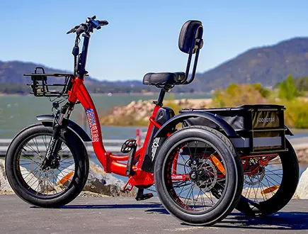 a triketan m330f etrike next to the lake