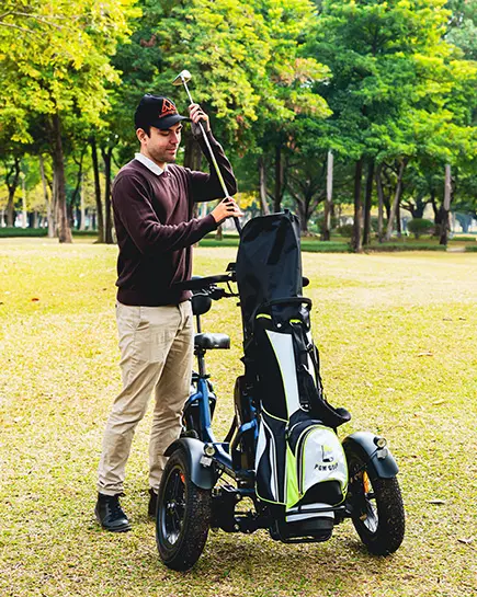 a man take out shaft from Spytan X electric trike