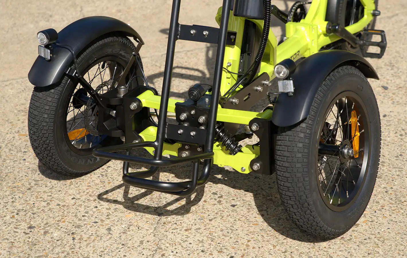 SpytanX electric trike riding through the bump