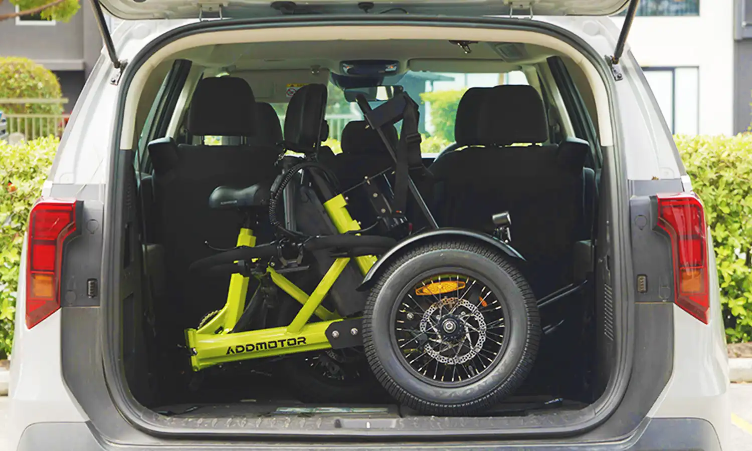A spytan X electric trike is folded into a car