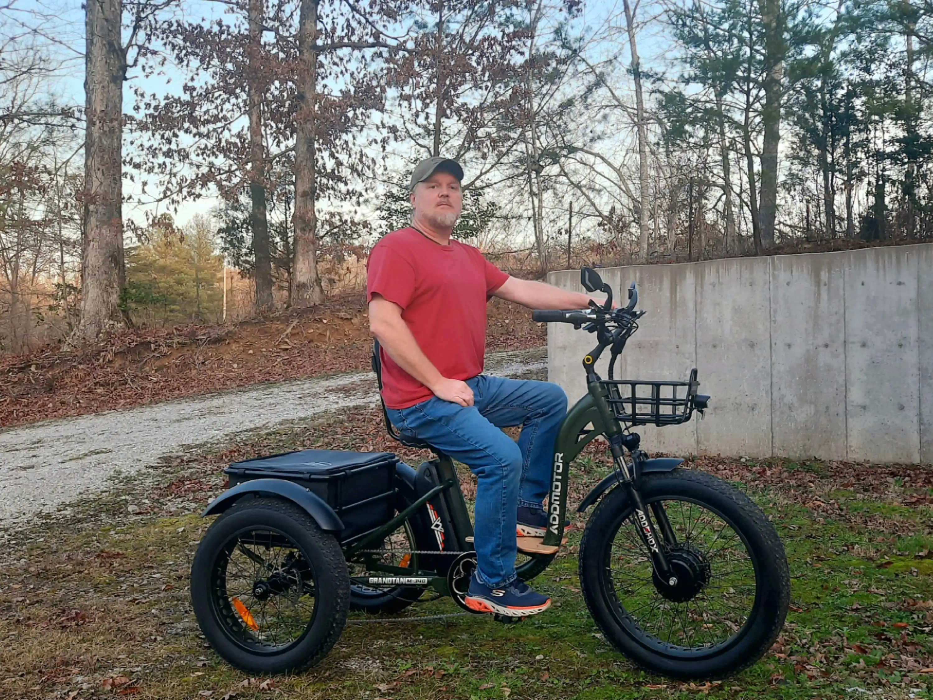 A man is riding Addmotor Grandtan eTrike