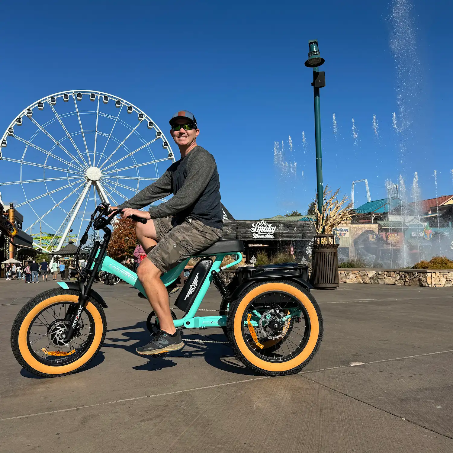 A man is riding Addmotor Herotri M-365X