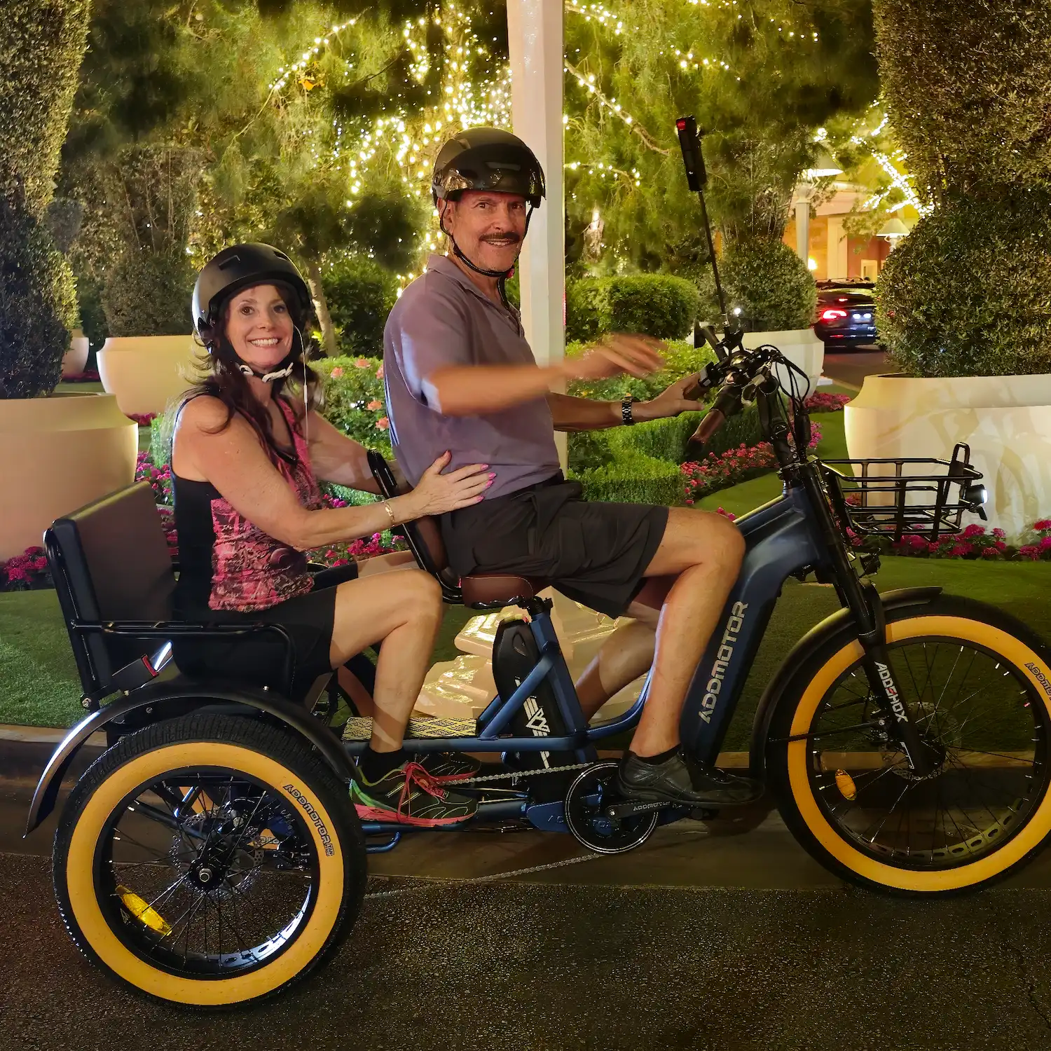 Two people riding on Addmotor Grandtan L together outside