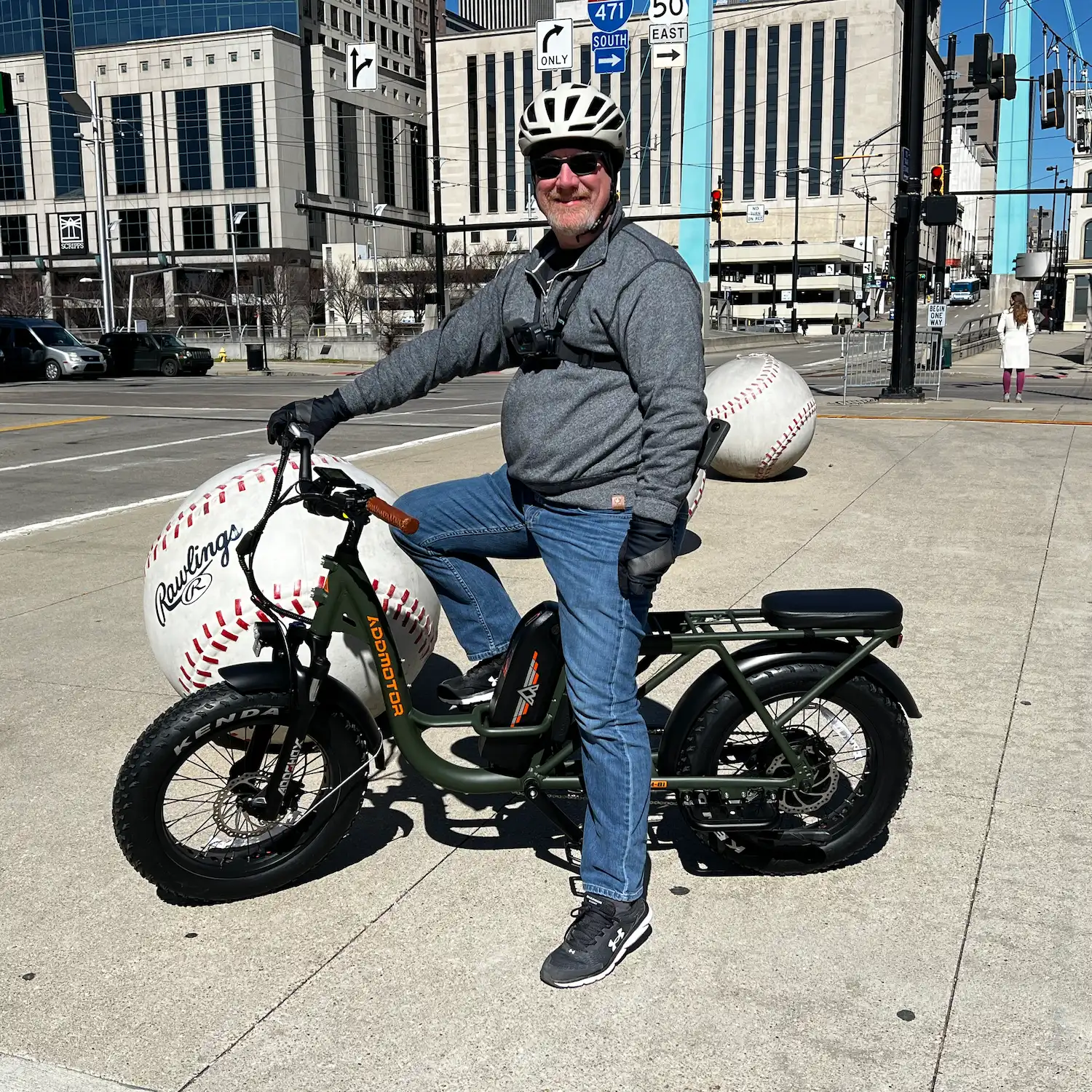 A man is riding Addmotor M-81 on the street