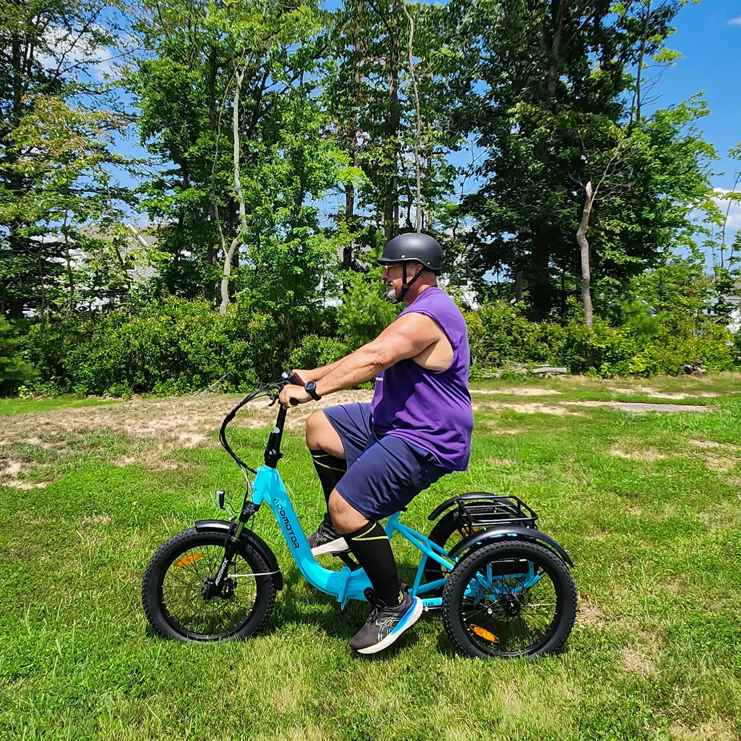 A man is riding Addmotor CITYTAN blue