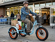 A senior rider confidently commuting on a 3 wheel electric bike for adults with the frame locked in a safe, anti-tip electric trike setting.